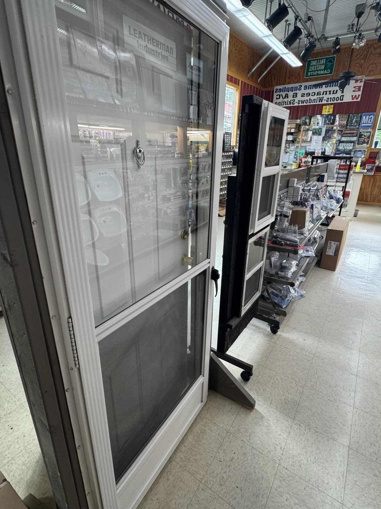 Mobile home replacement doors and window supplies displayed inside Leatherman’s mobile home supplies store.